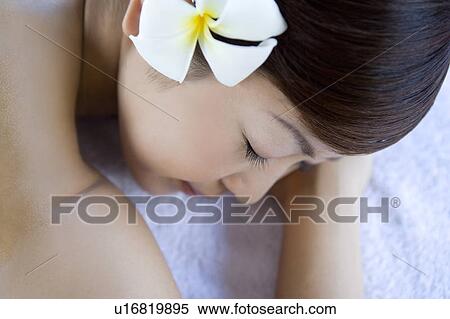 Young woman lying on massage table, Saipan View Large Photo Image Stock Photography - Young woman lying on massage table, Saipan. Fotosearch