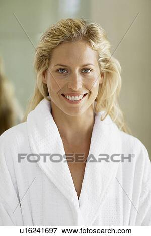 Mid adult woman in dressing gown (portrait) View Large Photo Image Stock Photo - Mid adult woman in dressing gown (portrait). Fotosearch