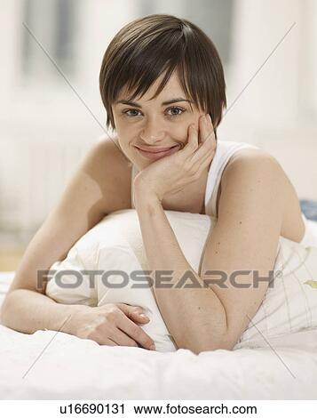 Portrait of Young Woman in Bed View Large Photo Image Stock Image - Portrait of Young Woman in Bed. Fotosearch