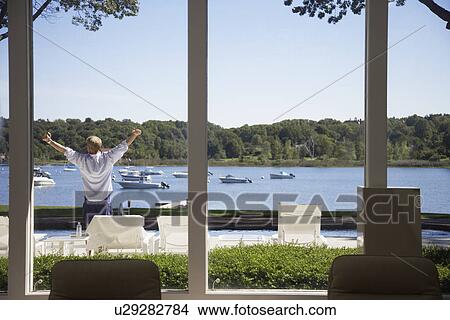 Man stretching by pool View Large Photo Image Picture - Man stretching by pool. Fotosearch