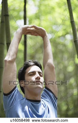 Stock Photo - Young man stretching. Fotosearch