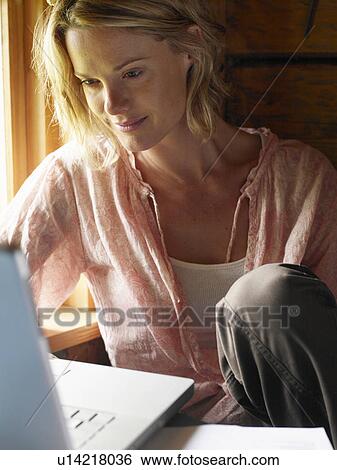 Businesswoman working from home View Large Photo Image Stock Photograph - Businesswoman working from home. Fotosearch