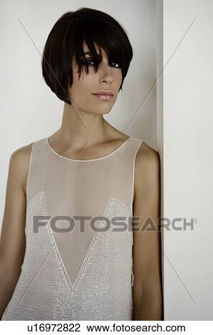 Stock Image - Portrait of woman standing.. Fotosearch