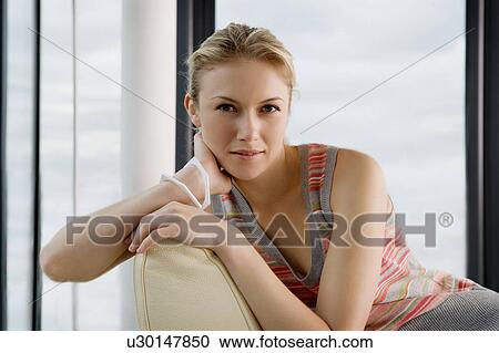 Woman on a sofa. View Large Photo Image Stock Image - Woman on a sofa.. Fotosearch