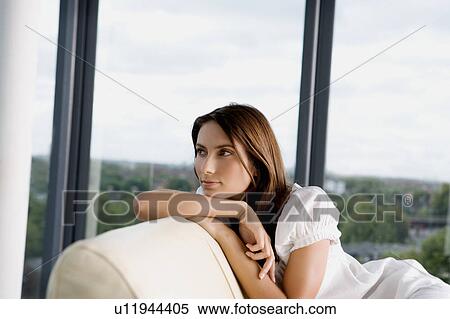 Woman on a sofa. View Large Photo Image Stock Photography - Woman on a sofa.. Fotosearch