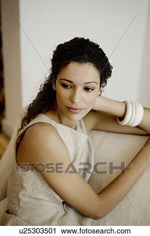 Woman sitting casually. View Large Photo Image Stock Image - Woman sitting casually.. Fotosearch