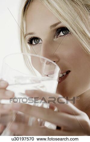 Stock Image - Woman with glass of water.. Fotosearch