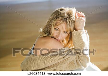 Mature woman stretching in a gym View Large Photo Image Stock Photo - Mature woman stretching in a gym. Fotosearch