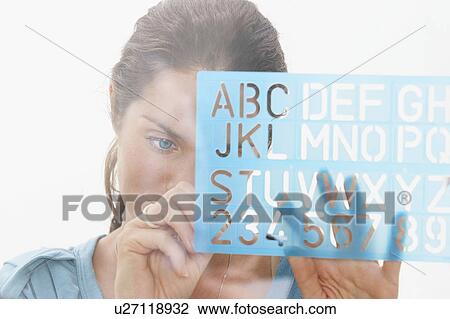 Close-Up portrait of woman through window using graphic drawing equipment. View Large Photo Image Stock Image - Close-Up portrait of woman through window using graphic drawing equipment.. Fotosearch