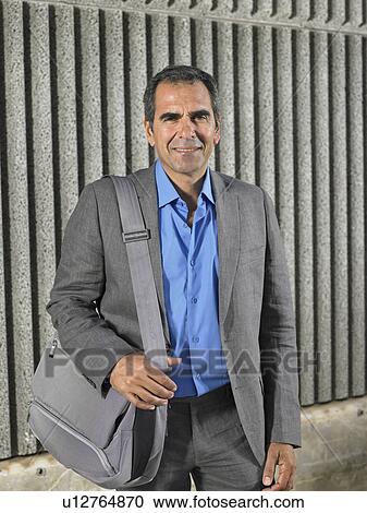 Portrait of older man in suit by textured concrete wall, Alicante, Spain, View Large Photo Image Stock Image - Portrait of older man in suit by textured concrete wall, Alicante, Spain,. Fotosearch