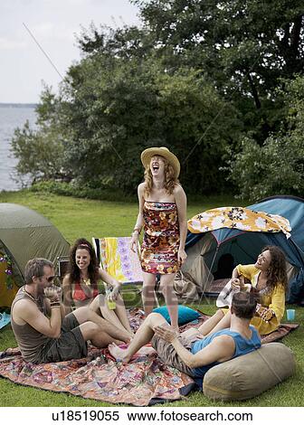 Stock Photography - Five people singing in camp. Fotosearch