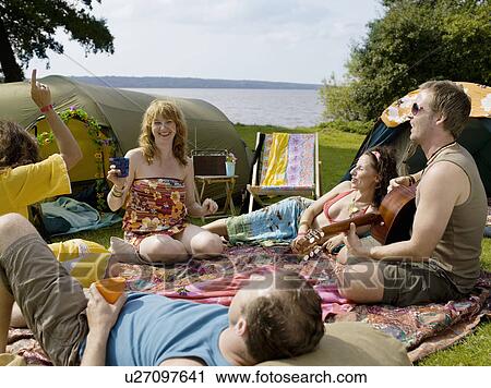 Five people singing together at camp View Large Photo Image Stock Image - Five people singing together at camp. Fotosearch