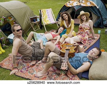 Stock Image - Group portrait of five at camp. Fotosearch