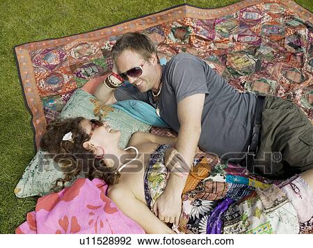 Man and woman lying on blanket View Large Photo Image Stock Image - Man and woman lying on blanket. Fotosearch