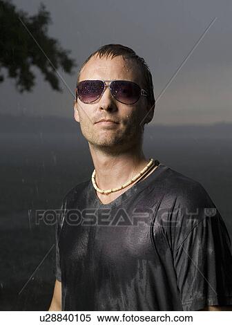 Man standing in the rain View Large Photo Image Stock Photography - Man standing in the rain. Fotosearch