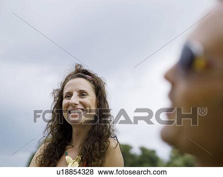 Two people talking View Large Photo Image Stock Photo - Two people talking. Fotosearch