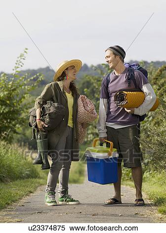 Stock Photography - Woman and man standing on path . Fotosearch