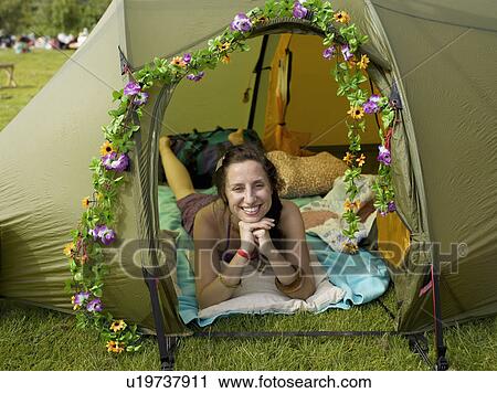 Woman lying inside tent looking out View Large Photo Image Stock Image - Woman lying inside tent looking out . Fotosearch