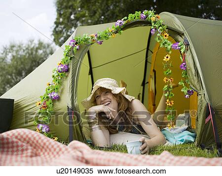 Woman lying inside tent looking out View Large Photo Image Stock Photography - Woman lying inside tent looking out . Fotosearch