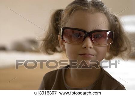 Girl (2-4)wearing sunglasses, Portrait View Large Photo Image Stock Photo - Girl (2-4)wearing sunglasses, Portrait. Fotosearch