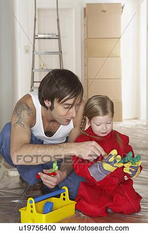 Girl (3-5) with father playing with plastic toolset View Large Photo Image Stock Image - Girl (3-5) with father playing with plastic toolset. Fotosearch