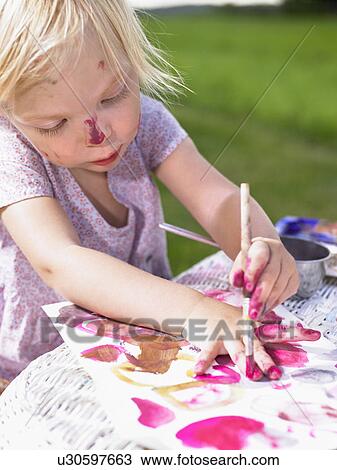 Little girl painting in a green field. View Large Photo Image Stock Image - Little girl painting in a green field.. Fotosearch