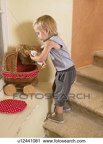 Little girl putting playing. View Large Photo Image Stock Image - Little girl putting playing.. Fotosearch