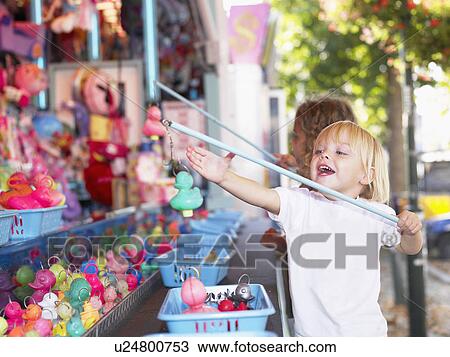 Little girls at a fair. View Large Photo Image Stock Image - Little girls at a fair.. Fotosearch