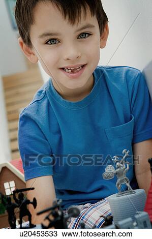 Portrait of a boy with toys. View Large Photo Image Stock Image - Portrait of a boy with toys.. Fotosearch