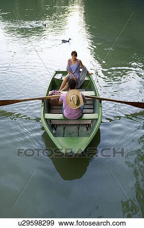 Stock Photo - Man and woman in a boat. Fotosearch