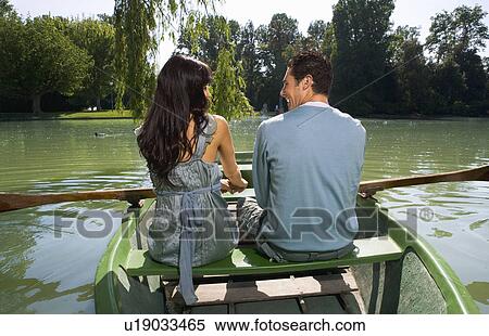 Man and woman in a boat View Large Photo Image Stock Photography - Man and woman in a boat. Fotosearch