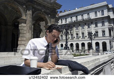 Man by the opera house in Hungary. View Large Photo Image Stock Image - Man by the opera house in Hungary.. Fotosearch
