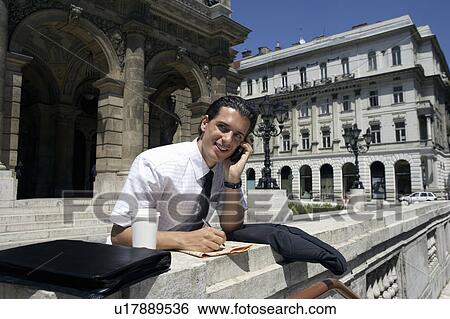Man by the opera house in Hungary. View Large Photo Image Stock Photograph - Man by the opera house in Hungary.. Fotosearch