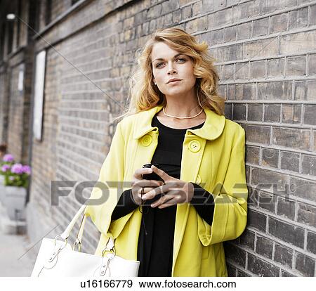 Woman standing outdoors View Large Photo Image Stock Photo - Woman standing outdoors . Fotosearch
