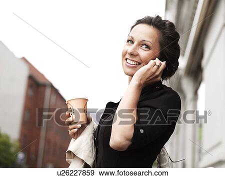 Stock Photo - Woman standing outdoors . Fotosearch