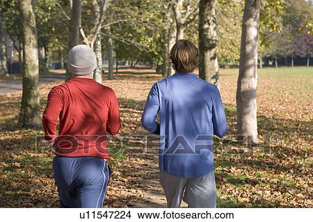 2 young men jogging rear view. View Large Photo Image Picture - 2 young men jogging rear view.. Fotosearch