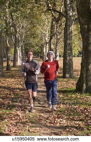 2 young men jogging. View Large Photo Image Stock Photography - 2 young men jogging.. Fotosearch