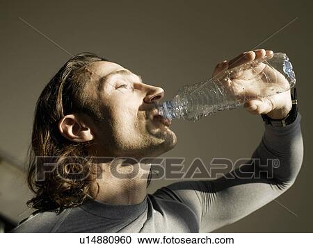 Mature man drinking water, close-up View Large Photo Image Stock Image - Mature man drinking water, close-up. Fotosearch