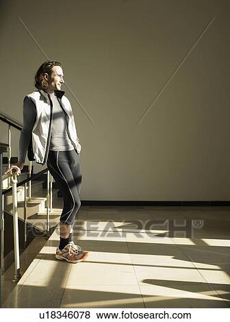 Stock Photo - Mature man standing on steps. Fotosearch