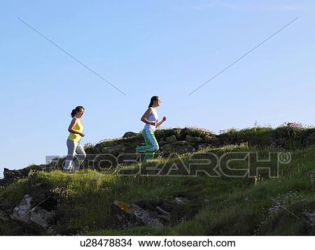 Two women jogging. View Large Photo Image Picture - Two women jogging.. Fotosearch