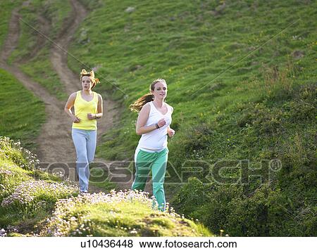 Two women jogging. View Large Photo Image Stock Photo - Two women jogging.. Fotosearch