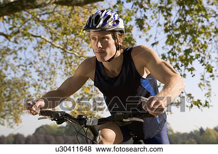 Cyclist riding mountain bike. View Large Photo Image Stock Photo - Cyclist riding mountain bike.. Fotosearch