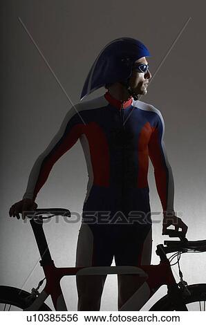Stock Photograph - Cyclist with time trial bicycle.. Fotosearch