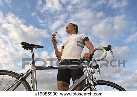 Man cycling in park View Large Photo Image Stock Image - Man cycling in park. Fotosearch