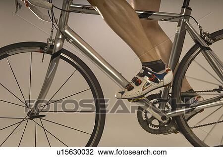 Stock Image - Man cycling. Fotosearch