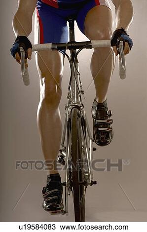 Stock Image - Man cycling. Fotosearch