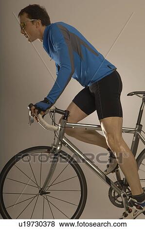 Man cycling View Large Photo Image Stock Photo - Man cycling. Fotosearch