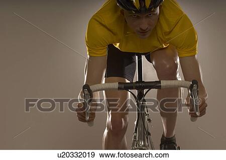 Man cycling View Large Photo Image Stock Photo - Man cycling. Fotosearch