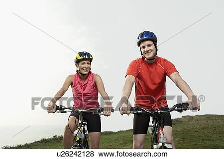 Portrait of a man and woman on bicycles. View Large Photo Image Stock Photo - Portrait of a man and woman on bicycles.. Fotosearch