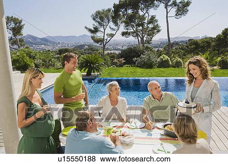 Family eating by poolside. View Large Photo Image Stock Photo - Family eating by poolside.. Fotosearch
